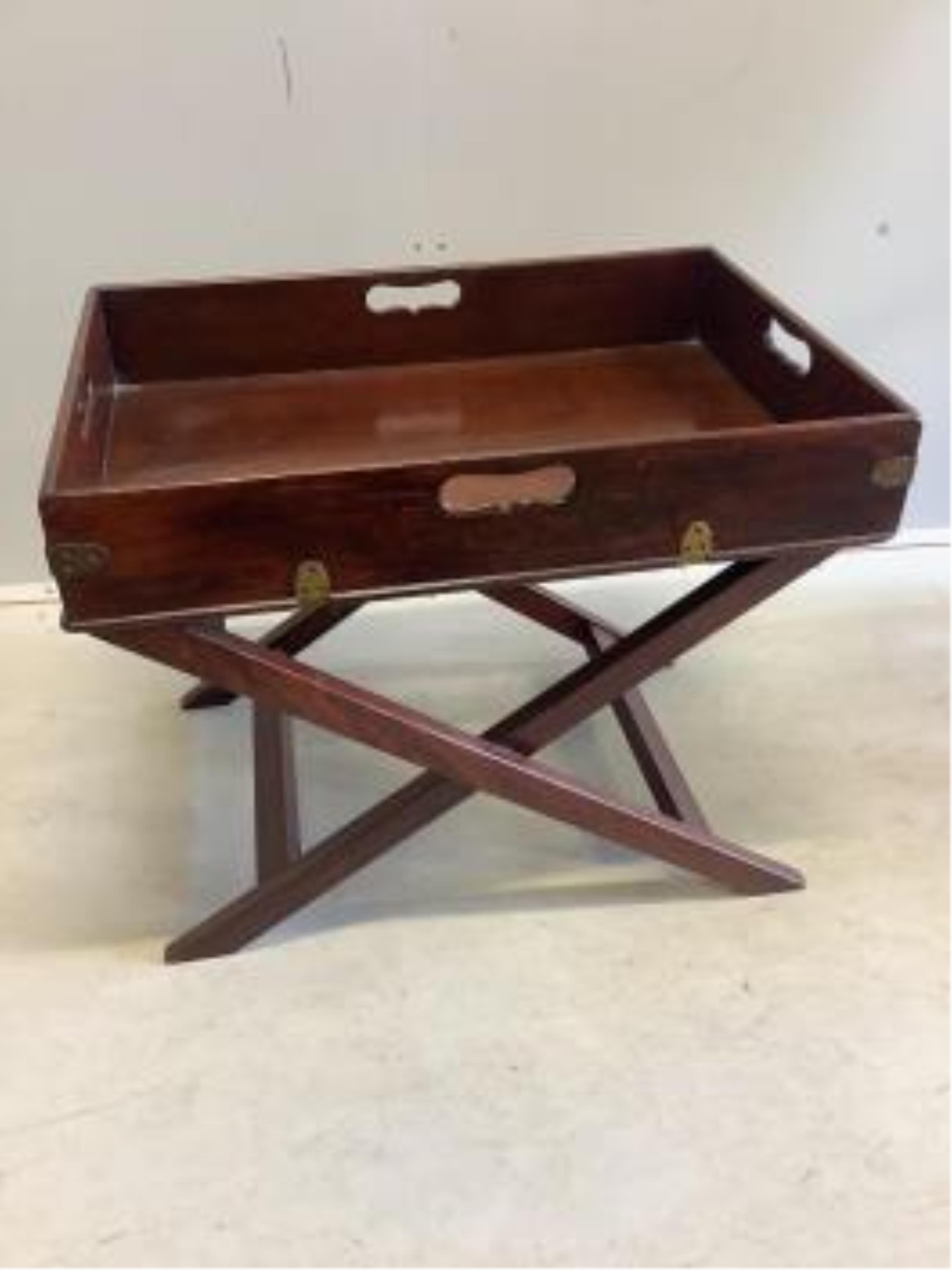 A Victorian rectangular mahogany butler's tray on later X frame stand, width 64cm, depth 44cm, height 51cm. Condition - fair